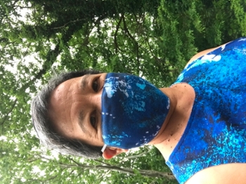 OMA director Elizabeth "Like" Lokon wearing an OMA mask