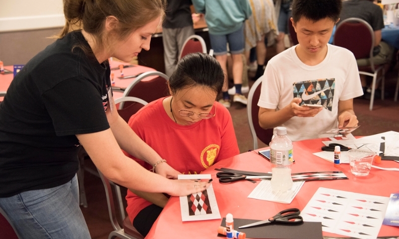 Miami University students attend Art After Dark in 2017 and learn to make bookmarks inspired by Myaamia ribbonwork.