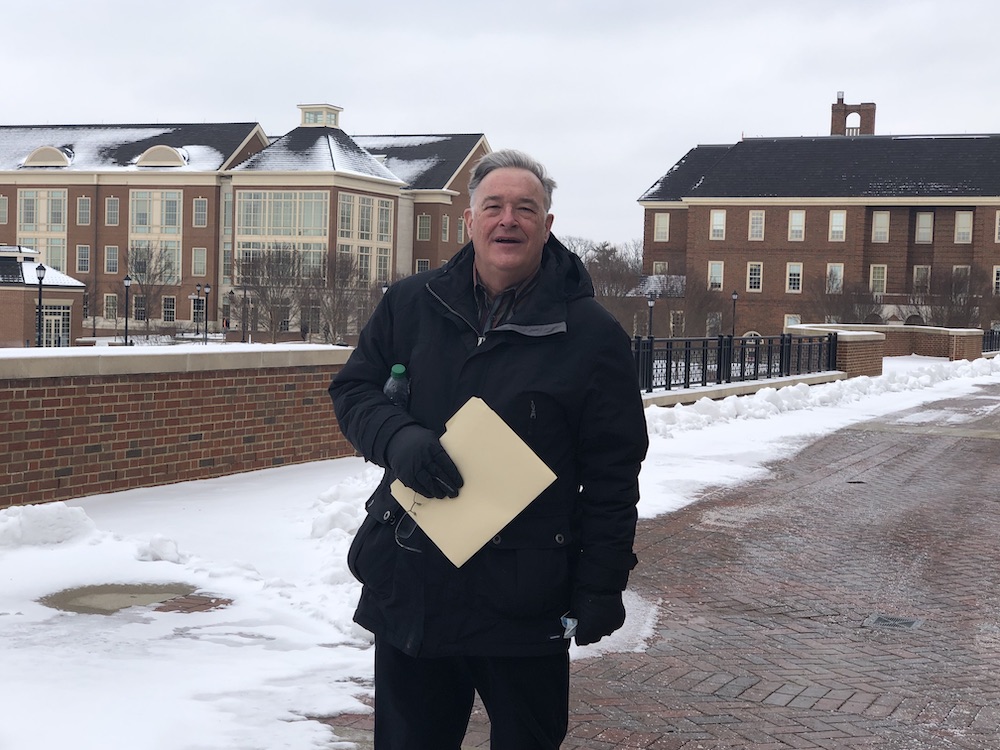 Whitlatch standing outside in a winter coat on the Miami Oxford campus. 