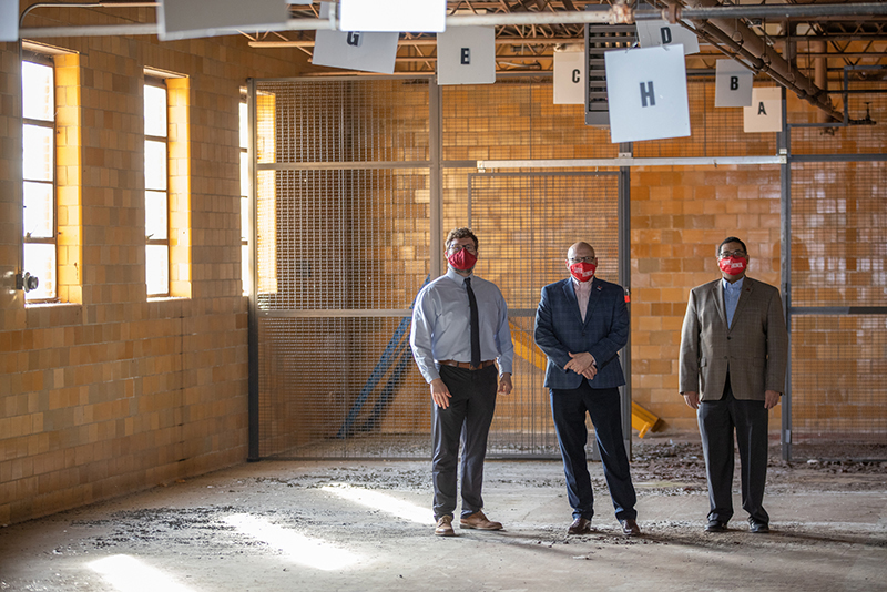 President Gregory Crawford inside of the building that is under renovation and will become the new home of College at Elm