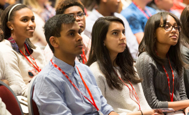 group of high school students sit and face forward