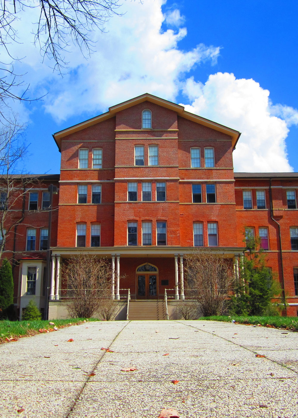 Peabody Hall, a red brick building with steps leading up to the front porch