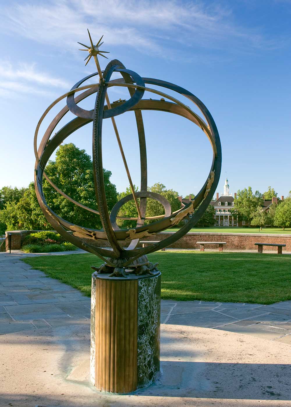 The sundial in view of McCracken Hall in the distance on a sunny day