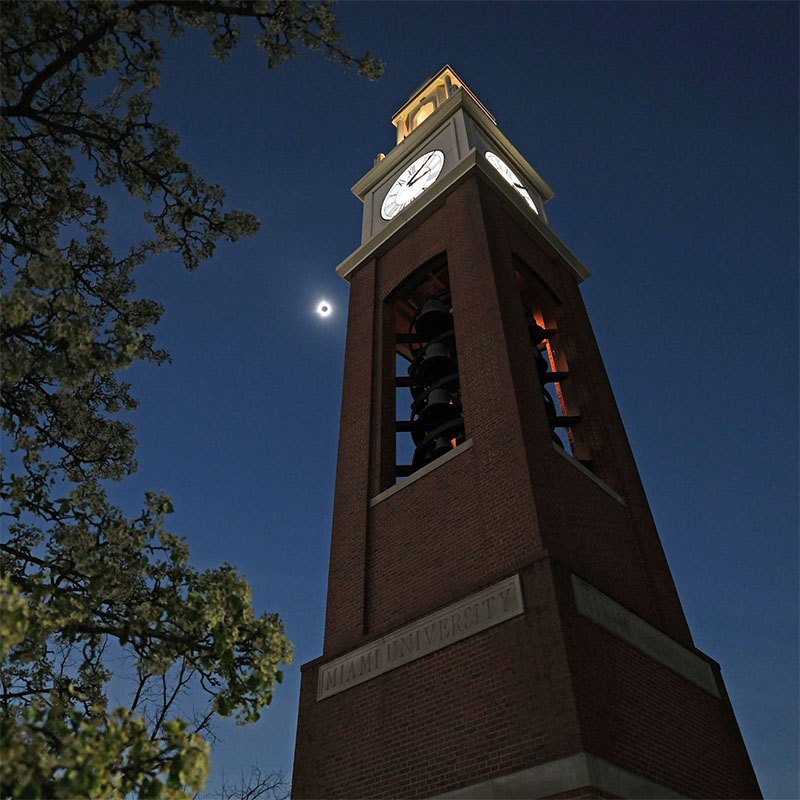 Bell tower in front of a darkening sky