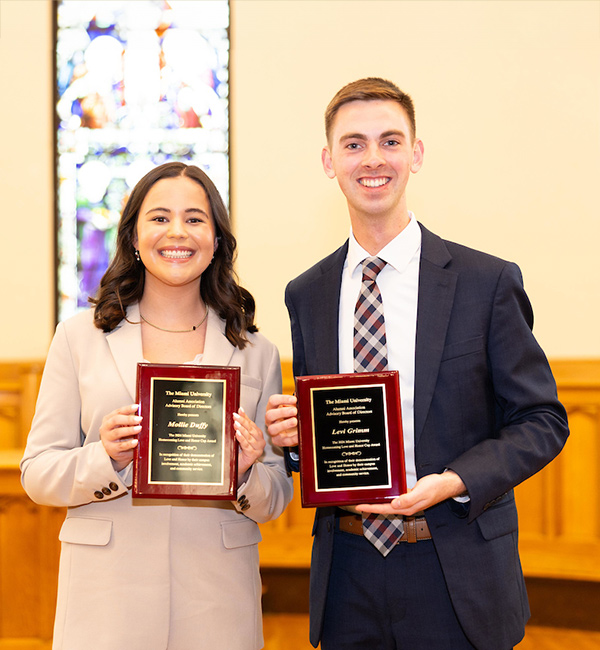 Molie Duffy and Levi Grimm with their awards