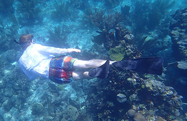 An Honors student explores a coral reef 