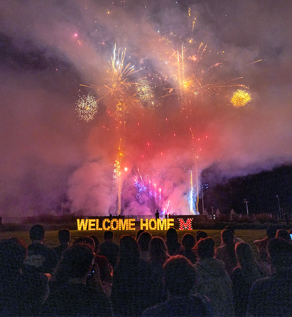 Students watching the welcome weekend fireworks
