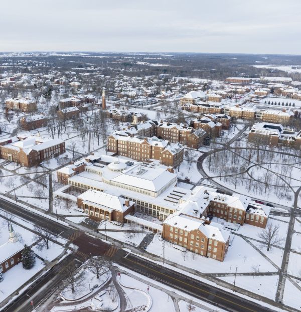 Aerial view over the Miami University Oxford, Campus showing the Armstrong Student Center blanketed in snow