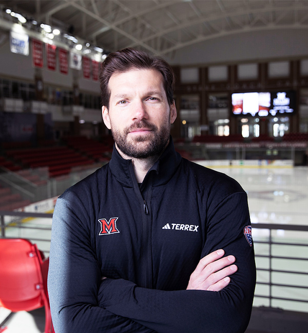 Coach Noreen in front of the ice