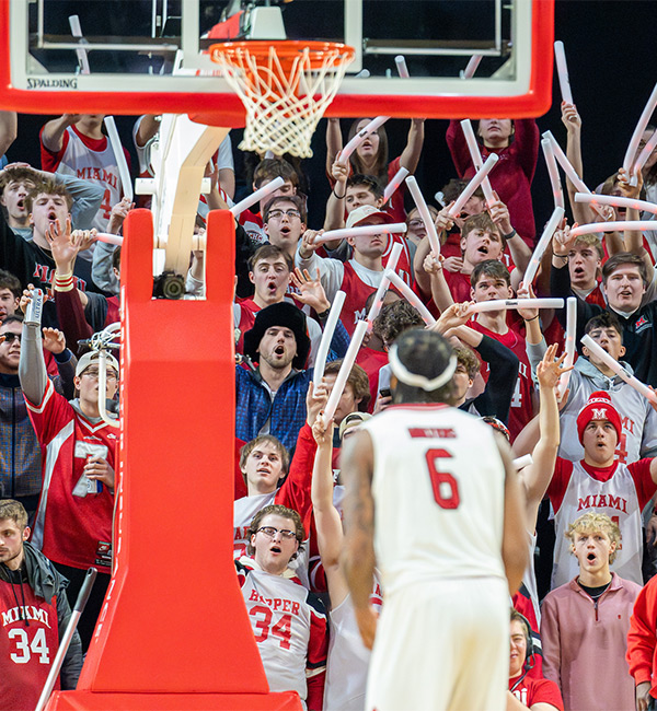 Miami Basketball yelling in celebration towards a packed crowd