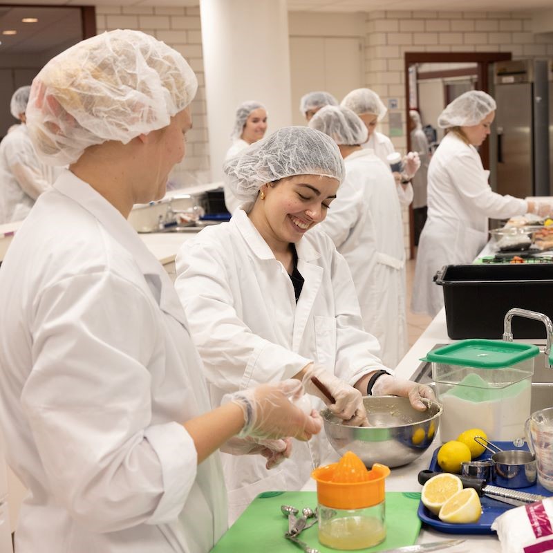Miami dietetics student prepare a meal in the lab
