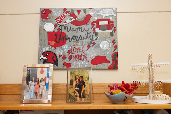 A Love and Honor sign in a dorm room