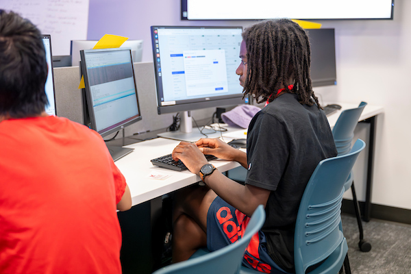Two students working in a computer lab