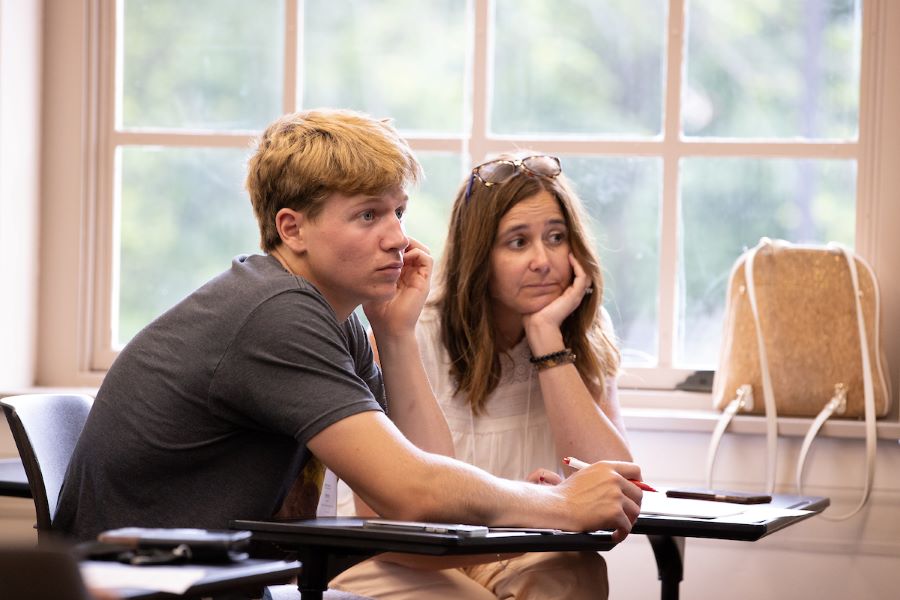 Advisor working with student at a computer