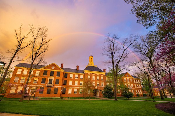 A rainbow appearing above Upham Hall.