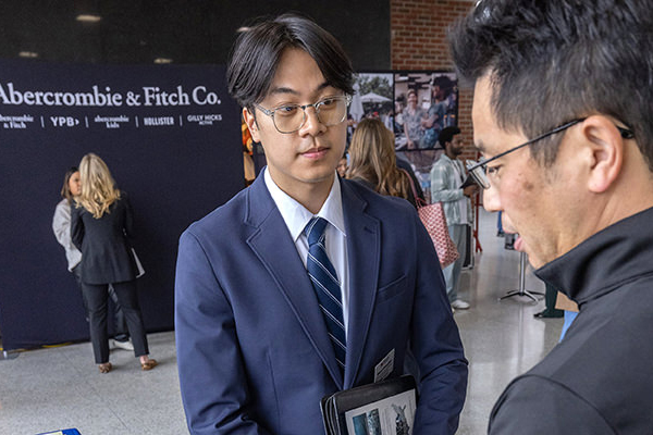 A Miami student meets with a potential employer at the annual Spring career fair.