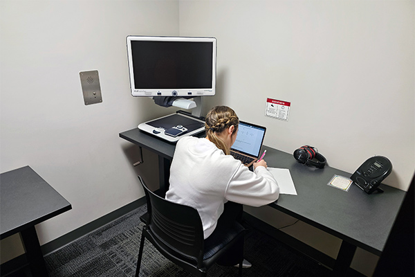 student taking an exam in a private room