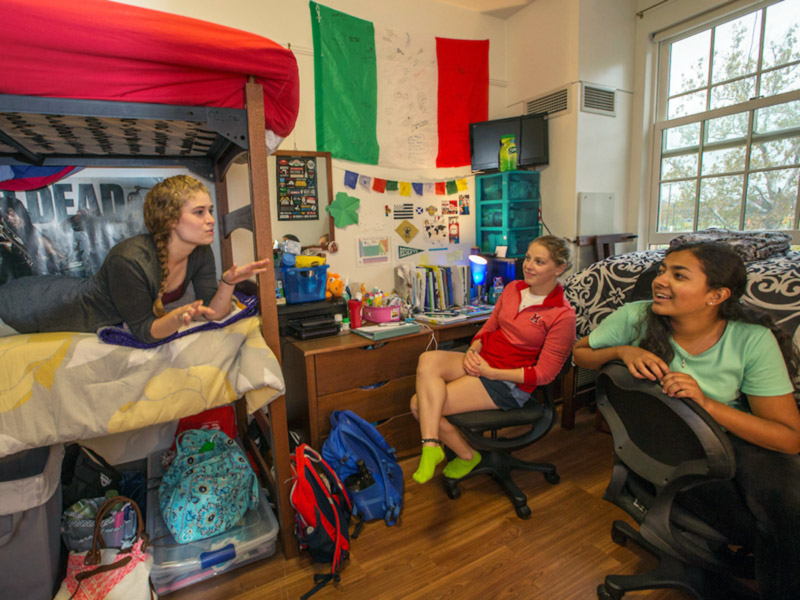 students hanging out in their dorm room