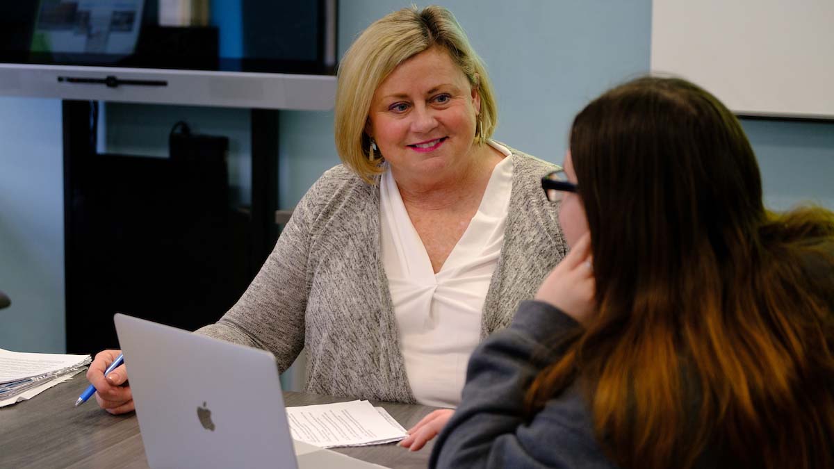 A student meeting with a counselor getting advice