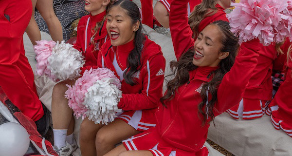 cheerleaders on a float during the homecoming parade