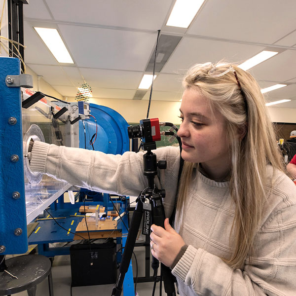 A woman working in a engineering tech lab