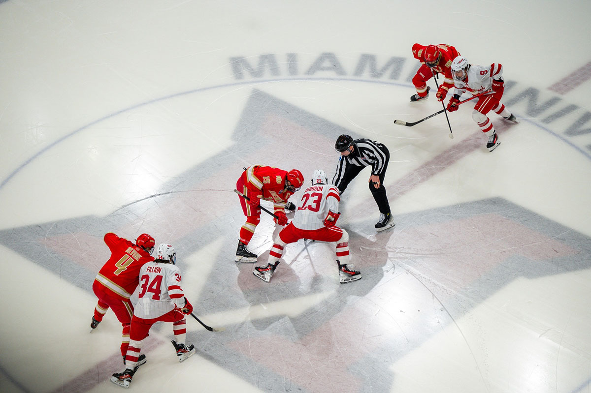 miami hockey varsity player controlling puck