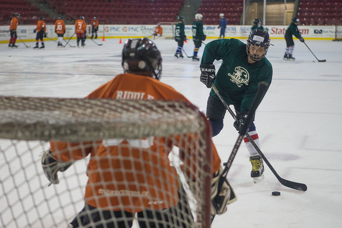 hockey player shooting