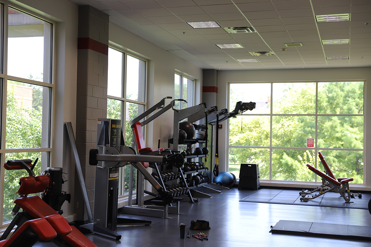Two Miami Rec Center patrons walking on the treadmill