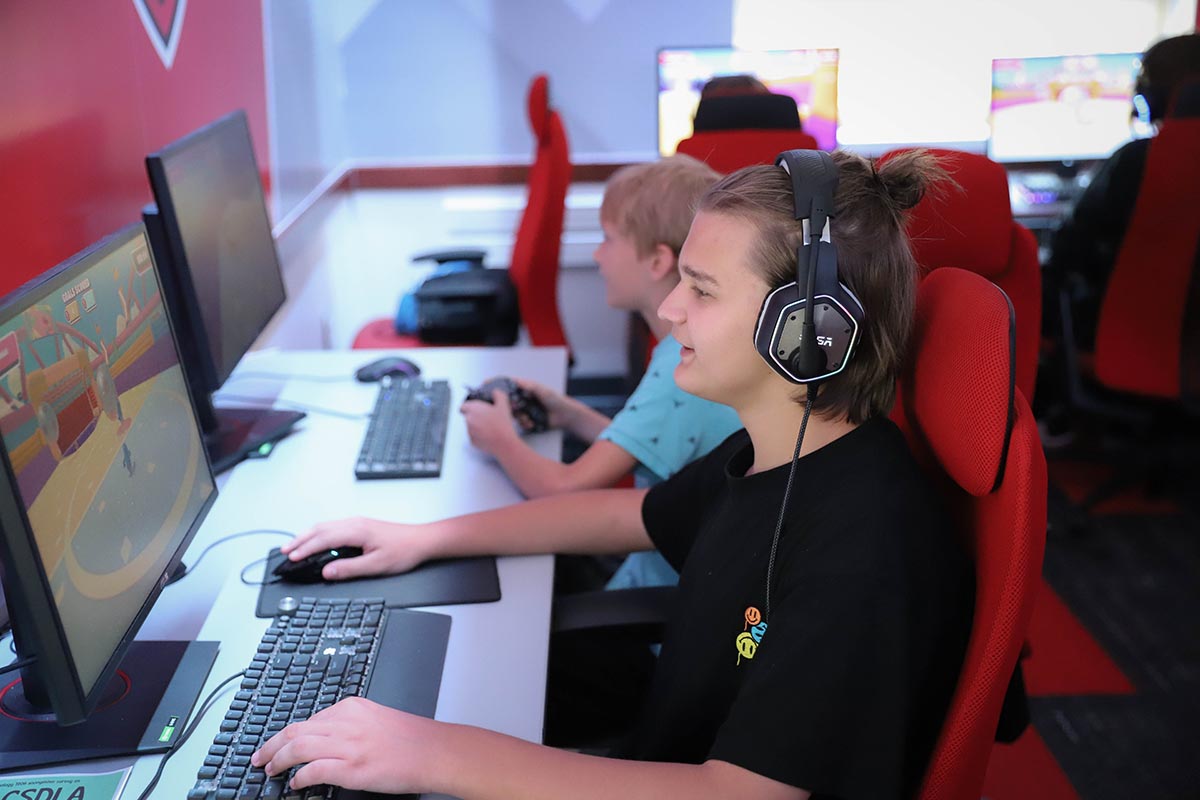 Child playing a video game in the esports lounge