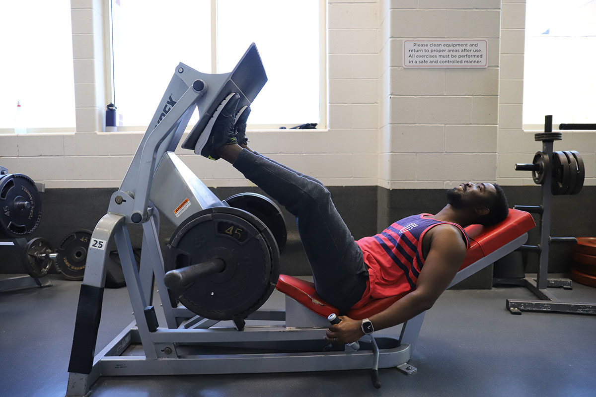 gym member using leg press