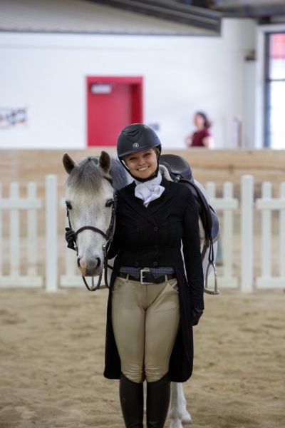Kathleen Kennedy posing with her horse.