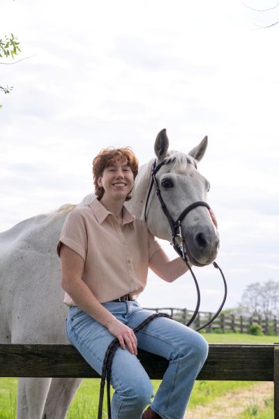 Marissa Dattomo posing with her horse outside