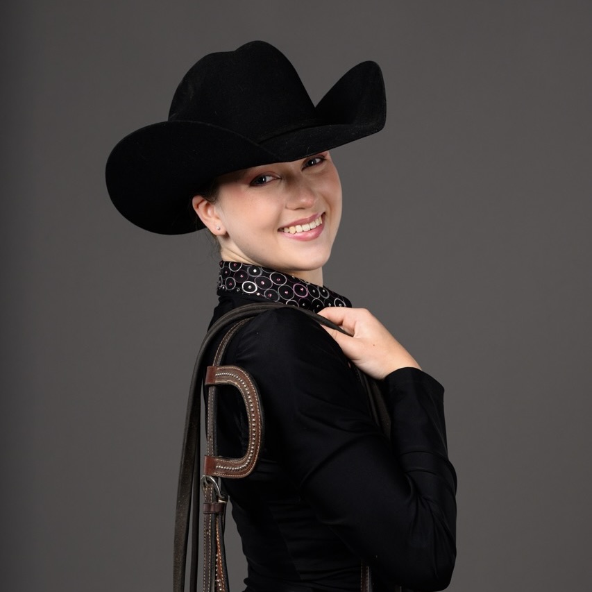 Grace Osterlund posing in riding gear