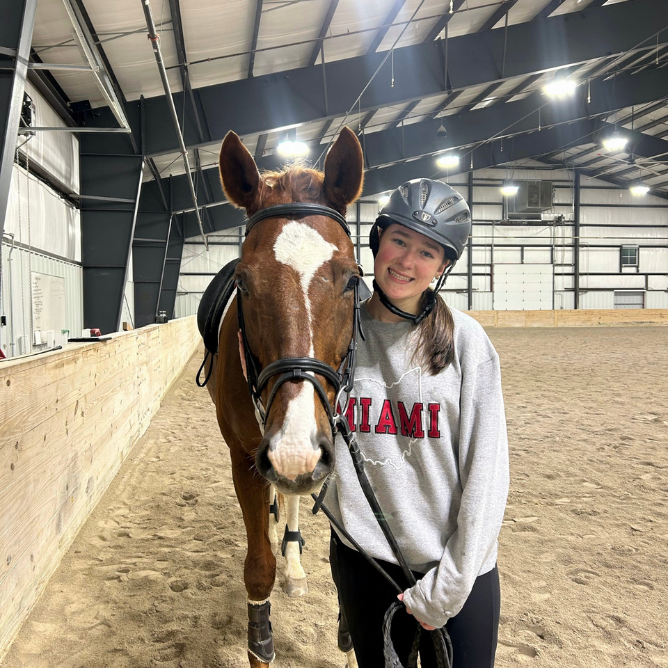 Katie Burke pictured next to a horse