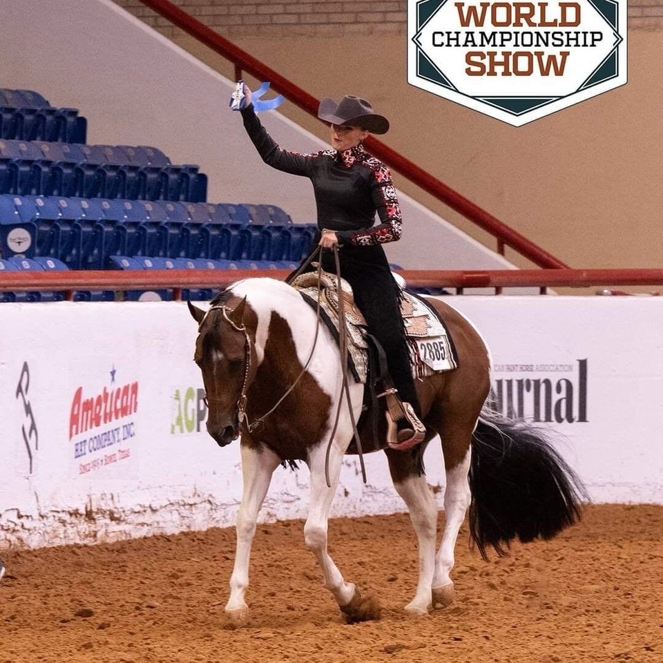 Makenna Noon riding her horse in an arena