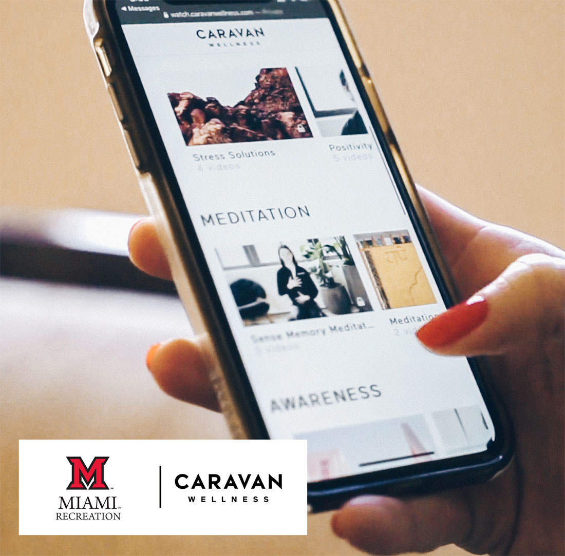Student's hand holding a phone scrolling through the services in the Caravan app