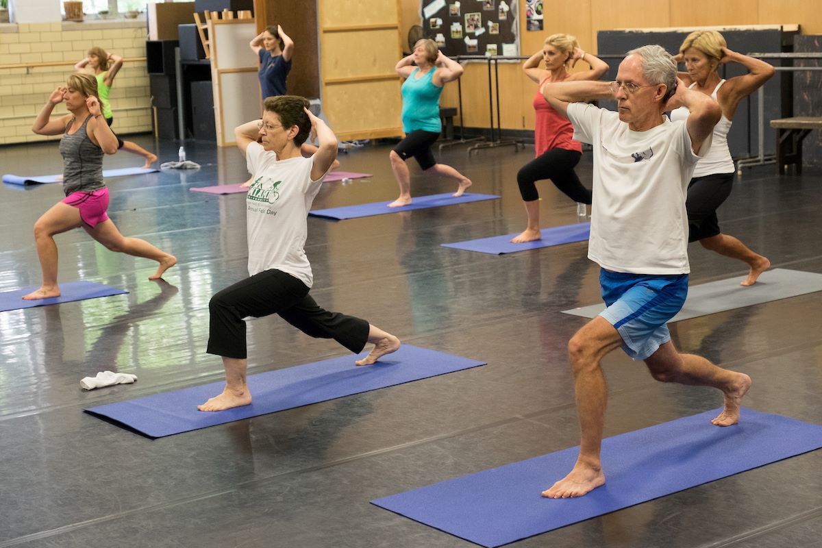 Faculty and staff taking a yoga class