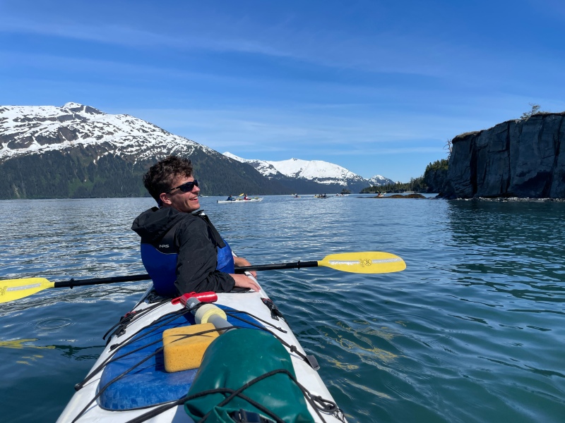 student in kayak on Alaskan sea