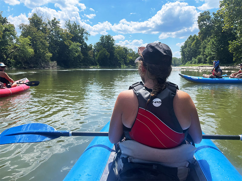 student in kayak on a river 