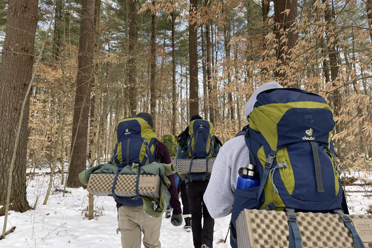 people hiking in the snow