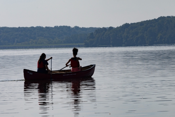 students on the river in a canoe