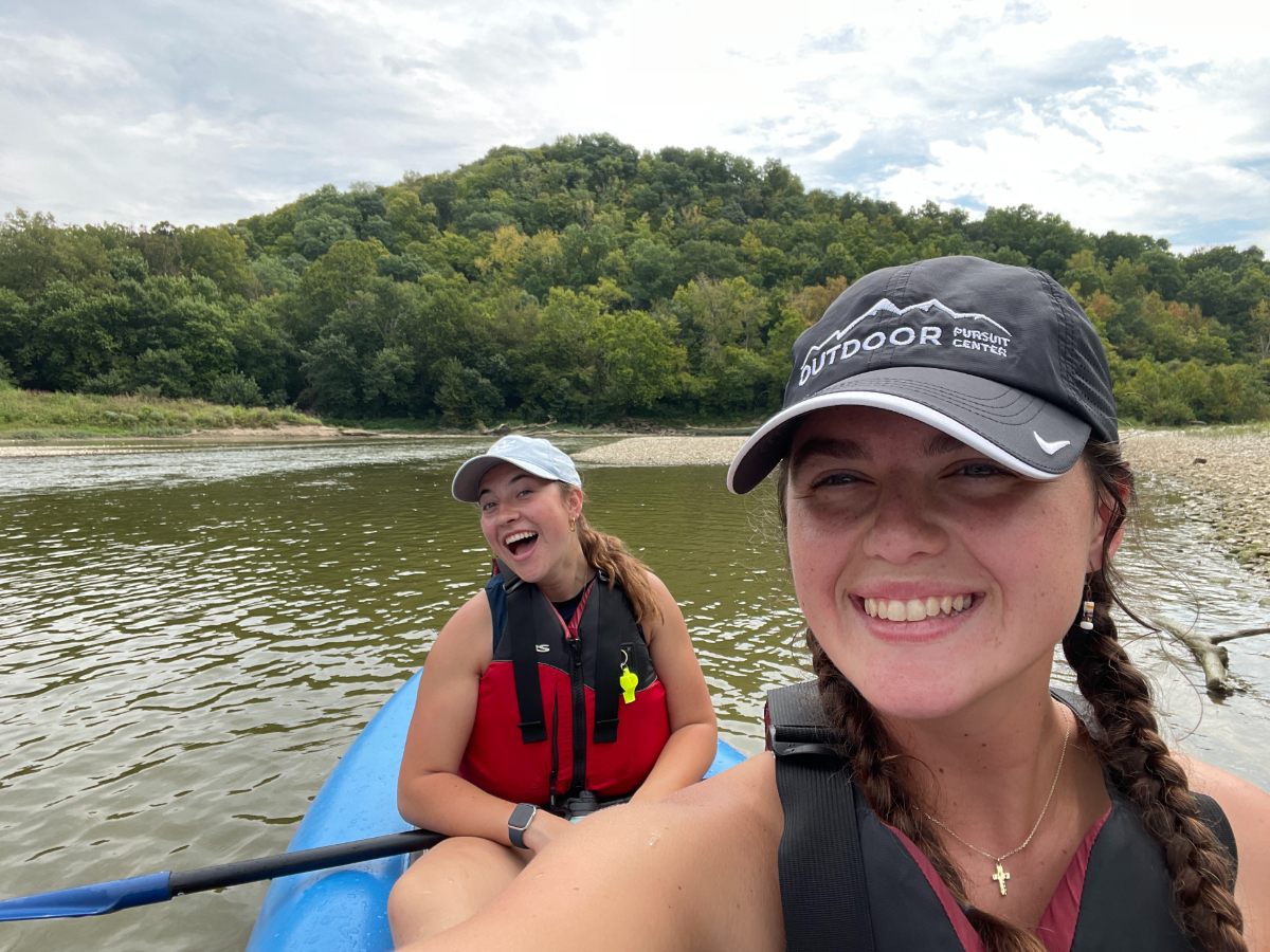 students on the river in a kayak