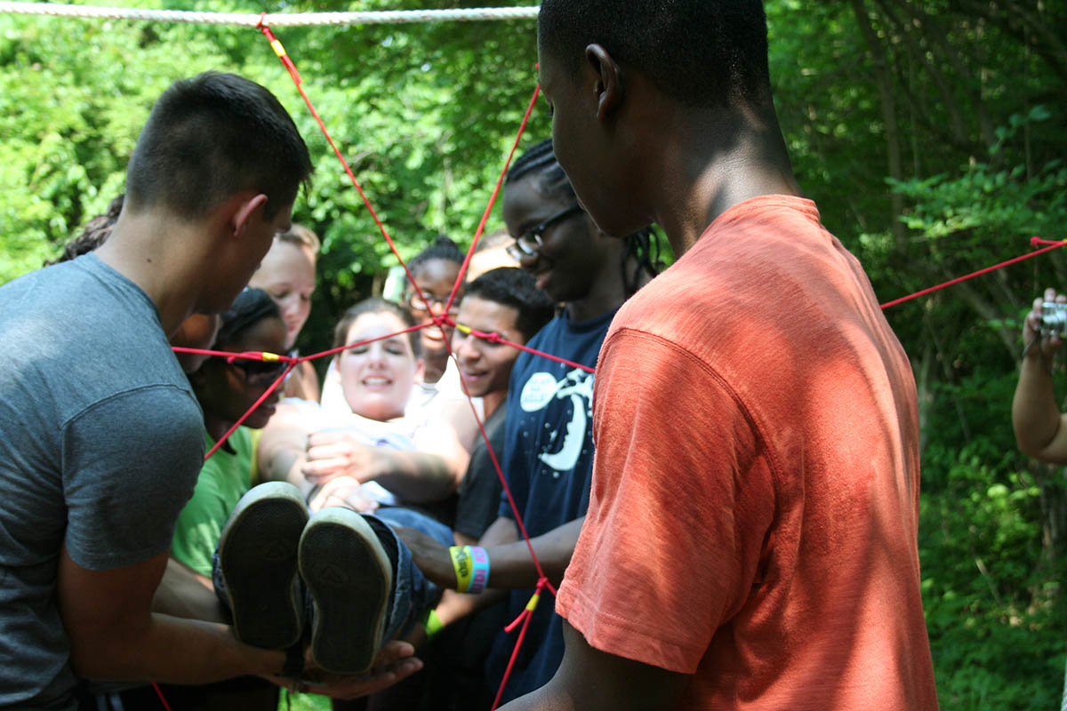 team members carrying a oerson