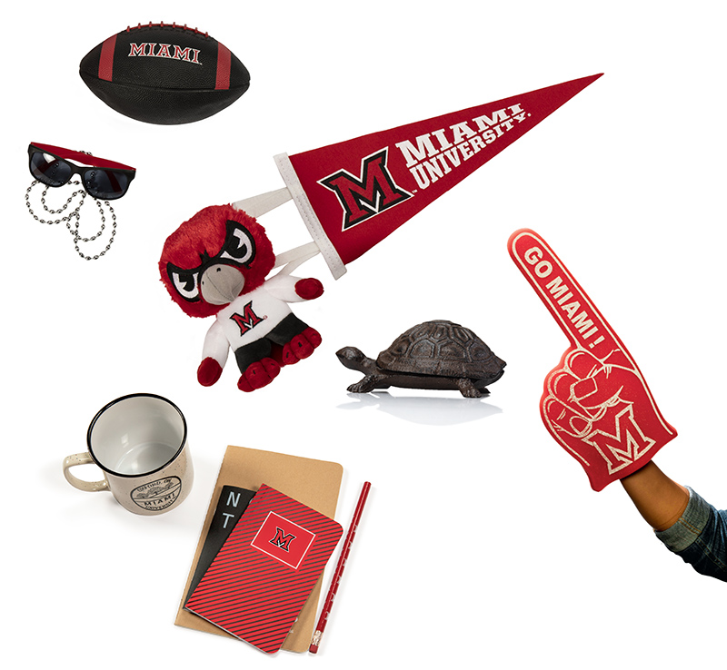 Collage of Miami University-themed items, including a football, pennant, foam finger, mascot plush, sunglasses, mug, notebooks, and a small turtle.