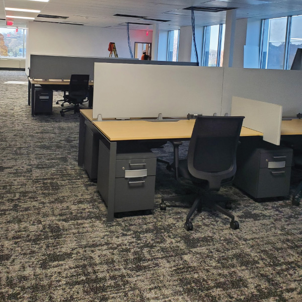 Cubicle desks in an open area.  