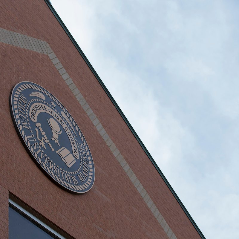 The Miami University seal displayed prominently on a Regionals campus building
