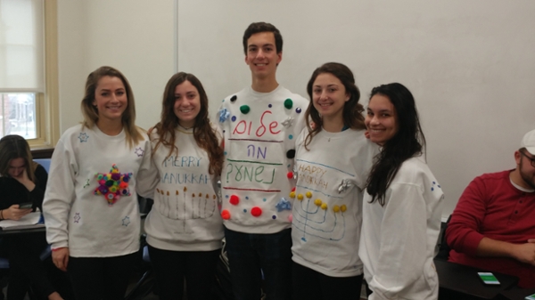 Students wearing Hanukkah sweaters