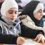 Muslim schoolgirls wearing head coverings