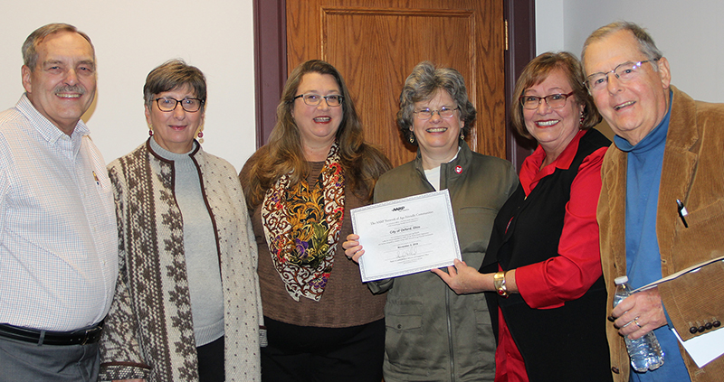 Celebrating the acceptance of the Oxford community into the AARP Network of Age-Friendly Communities are members of City Council and the Oxford VillAGE Network Steering Committee (from left) Steve Schnabl, Catherine Hollins, Jessie Leek, Mayor Kate Rousmaniere, Ann Whelpton and Steve Dana. 