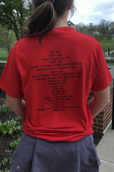 Student wearing Get Psyched t-shirt, back